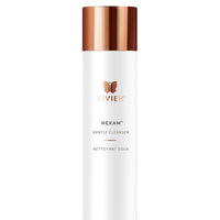A tall, white bottle of Vivier Hexam Gentle Cleanser with a metallic copper cap and the Vivier butterfly logo. The bottle indicates "150 ml | 5 fl oz" at the bottom.